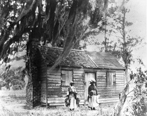 Simple cabin with two people in front 