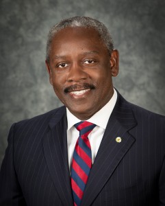 Headshot of Orange County Mayor Jerry L. Demings wearing red and blue striped tie