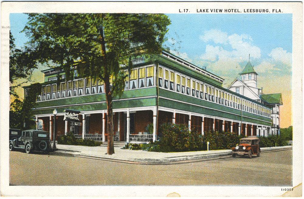 Vintage postcard showing Lake View Hotel in Leesburg with old fashioned car in front.