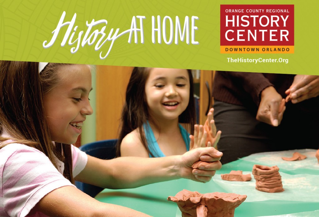 Two elementary school age girls make clay pots.