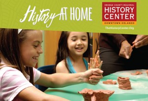 Two elementary school age girls make clay pots.